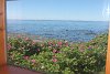 View of the sea from the window near the table